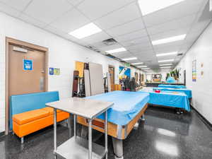 Miscellaneous room featuring a drop ceiling
