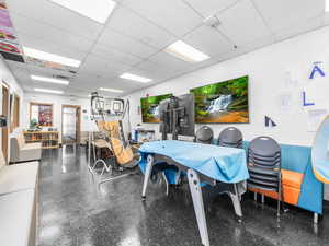 Misc room with a paneled ceiling