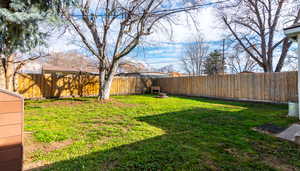 View of fenced backyard