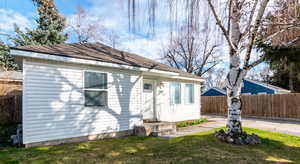Rear view of house with roof with shingles