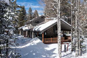 View of front of home featuring a wooden deck