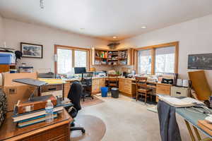 Office featuring light carpet and recessed lighting