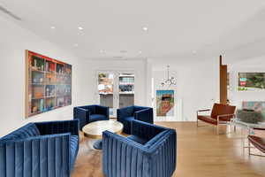 Living area featuring wood finished floors and recessed lighting