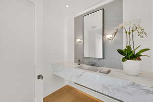 Bathroom featuring vanity and light wood-style flooring