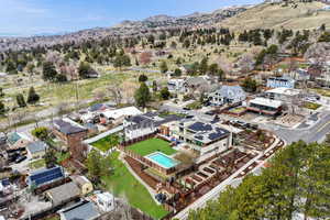 Aerial perspective of suburban area featuring a mountain backdrop