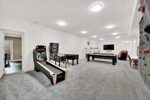 Game room featuring light colored carpet