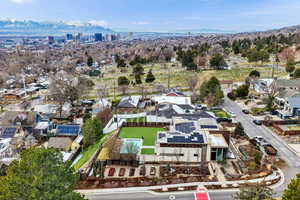 Aerial view of residential area featuring a mountainous background