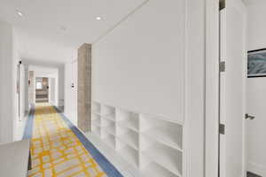 Hallway featuring light tile patterned flooring