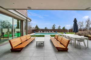 Fenced backyard with a patio