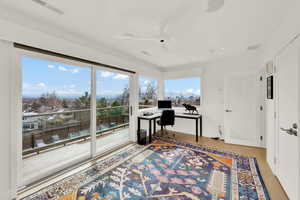Office featuring ceiling fan and light wood-style flooring