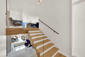 Staircase with tile patterned floors