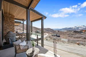 Balcony with a mountain view and outdoor dining space