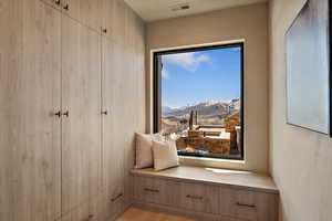 Sitting room featuring light wood finished floors and a mountain view