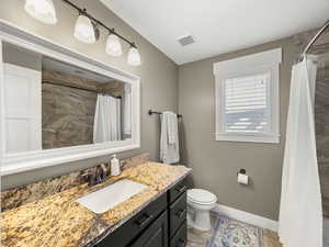 Bathroom featuring vanity and a shower with curtain