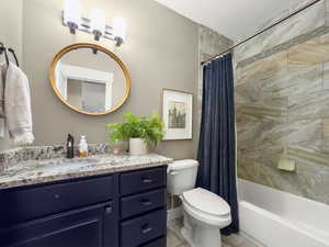 Full bathroom with vanity and shower / tub combo with curtain