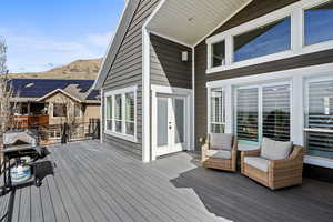 Wooden terrace featuring area for grilling