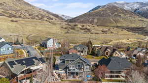 Aerial view of residential area featuring a mountain backdrop