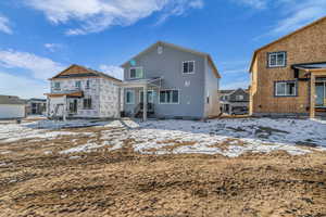 Snow covered house with a patio area