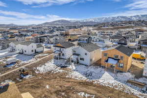 Snowy aerial view with a residential view and a mountain view