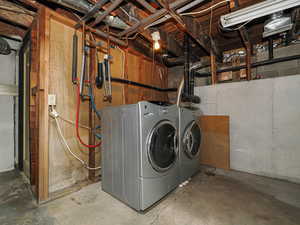 Laundry area in unfinished basement.