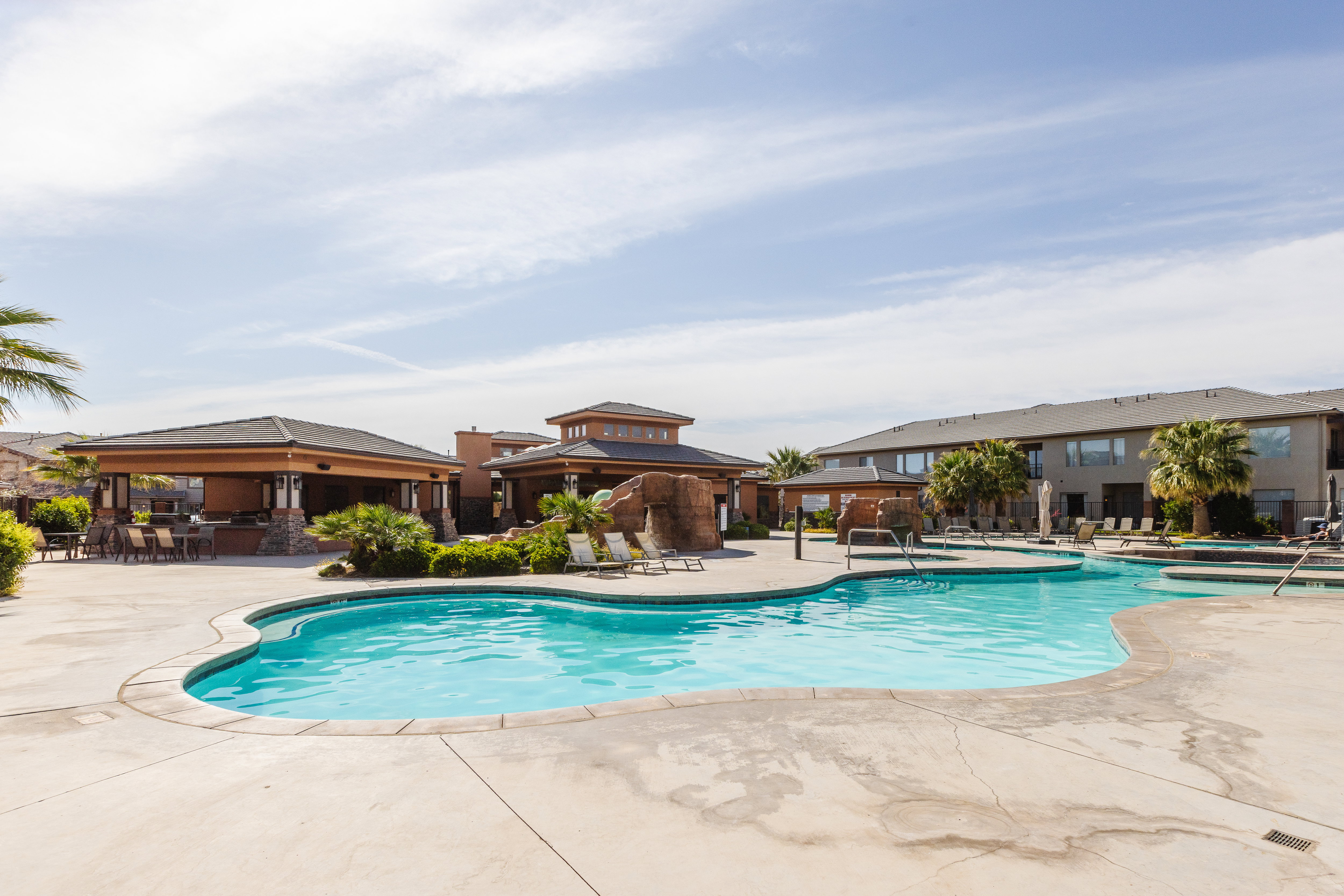 Community pool with a gazebo and a patio area