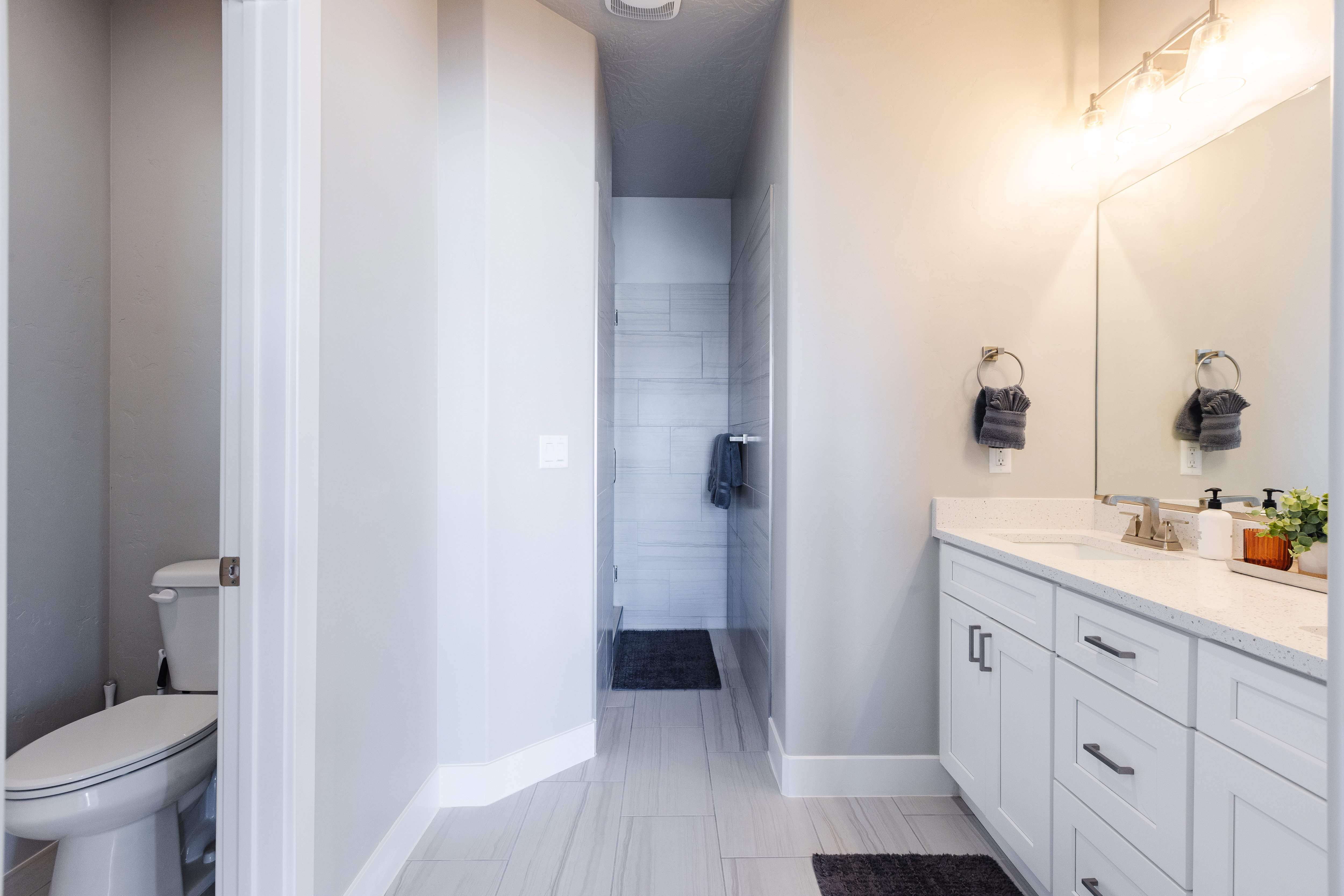 Full bathroom with baseboards and vanity