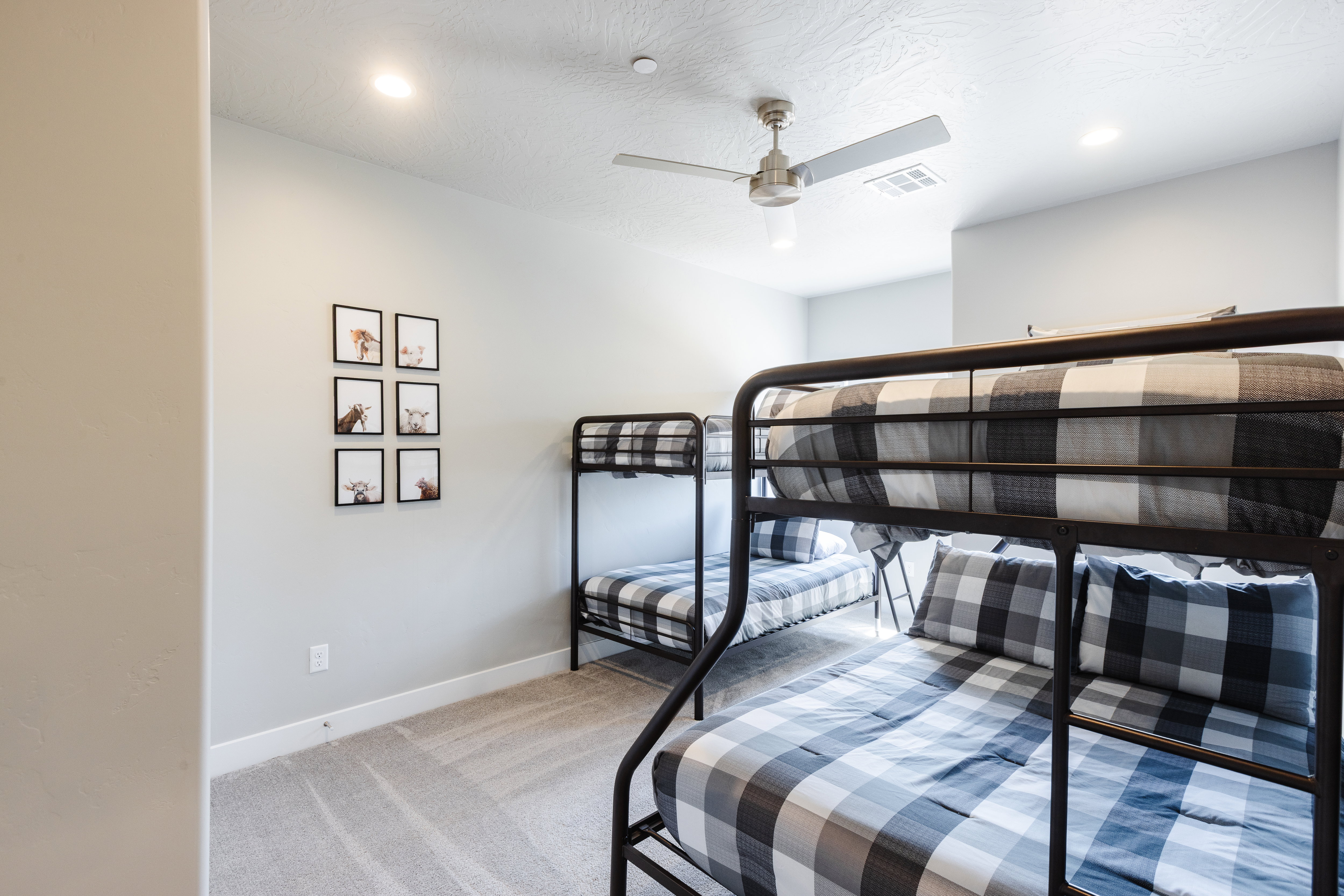 Bedroom featuring light colored carpet, ceiling fan, and recessed lighting
