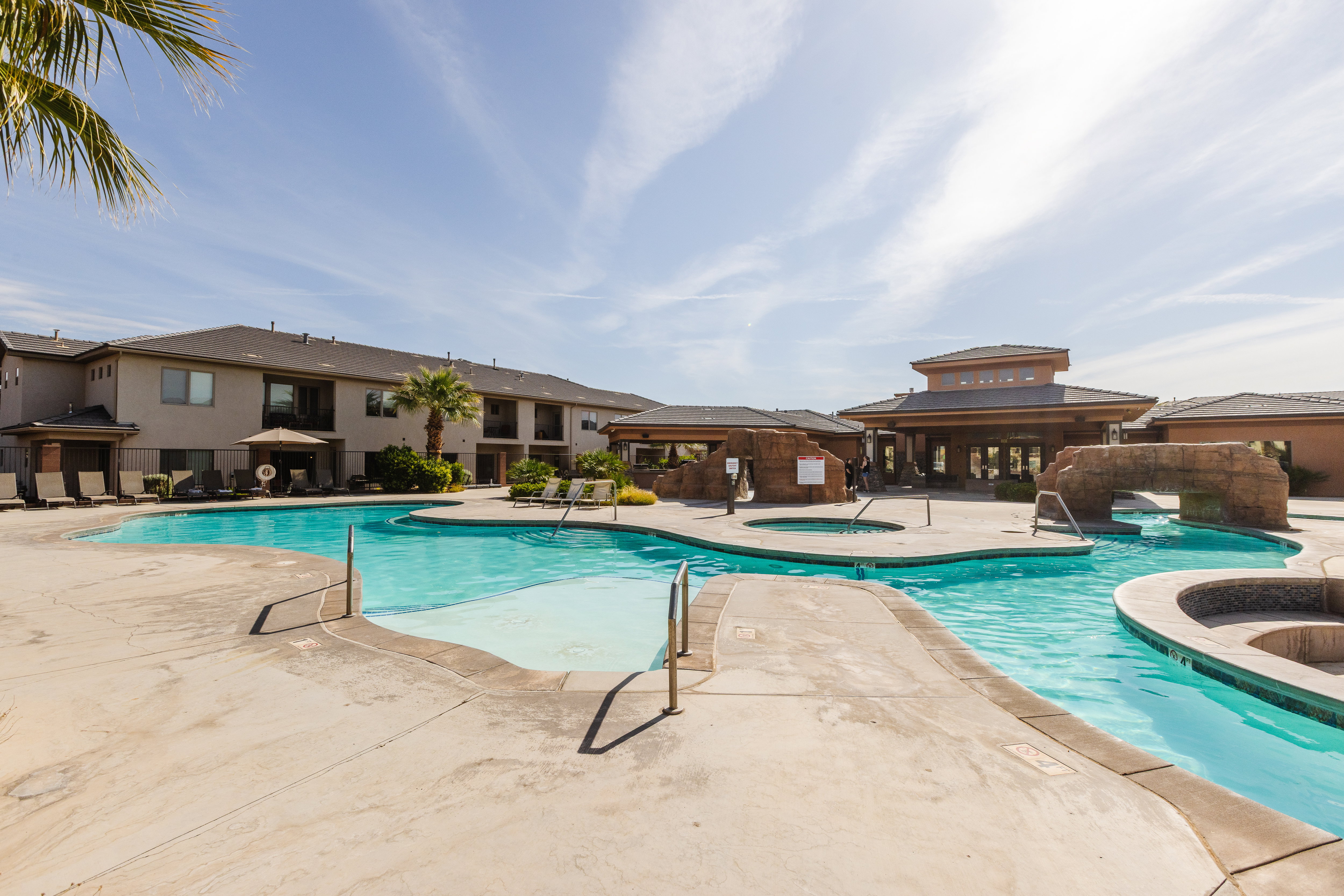 Community pool featuring a hot tub, a patio, and a gazebo