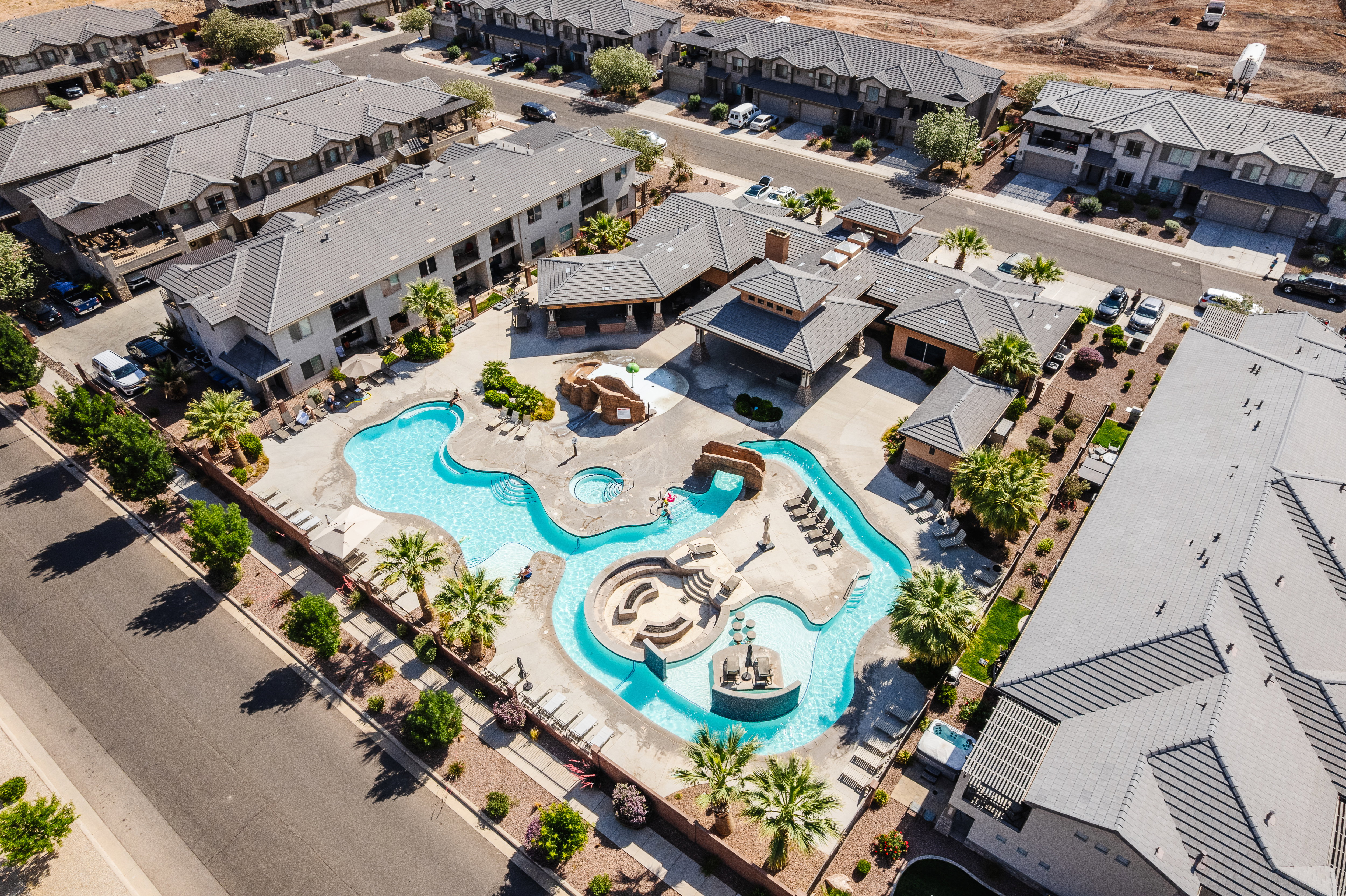 Aerial perspective of suburban area featuring a pool area