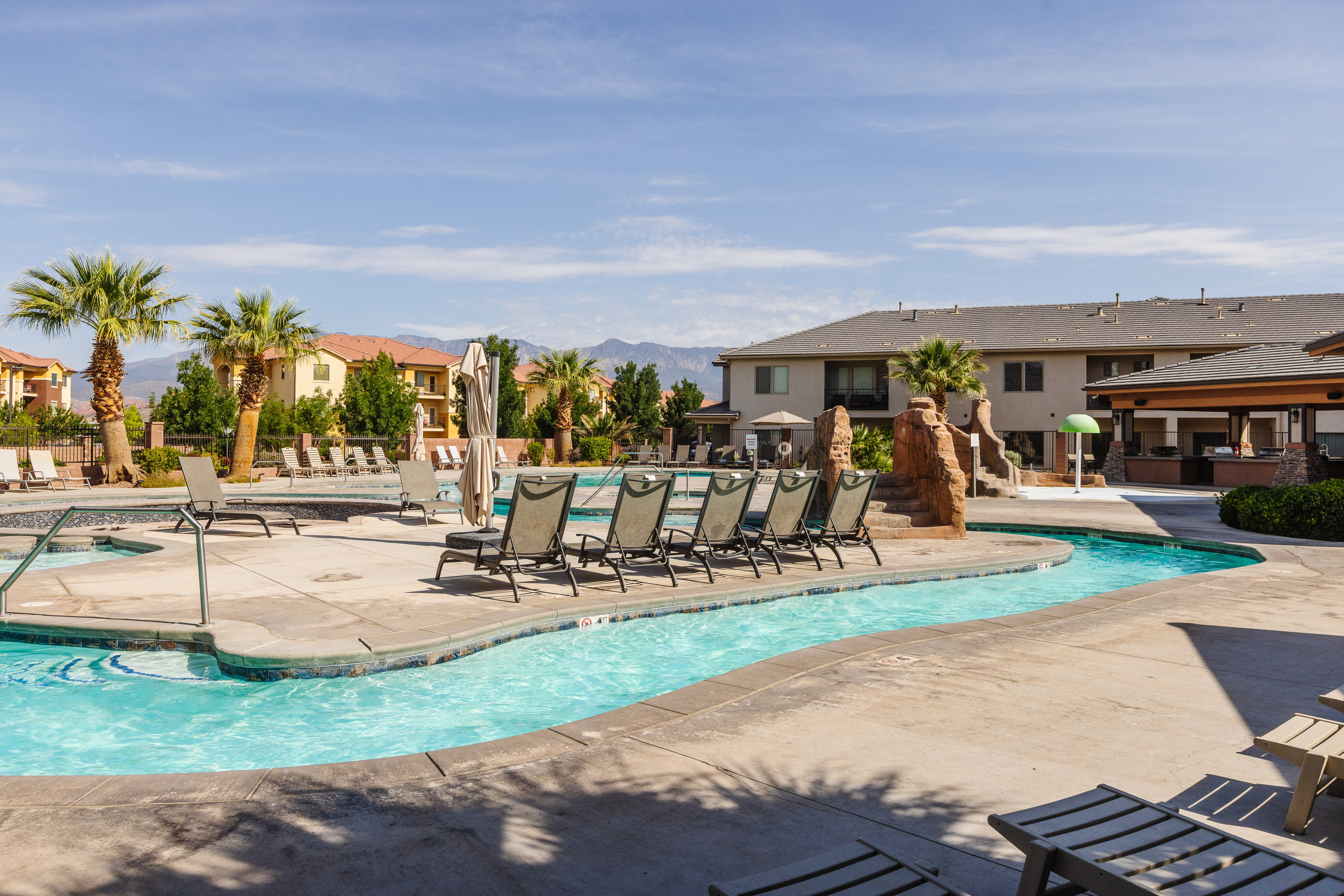 Community pool featuring a patio area and a residential view
