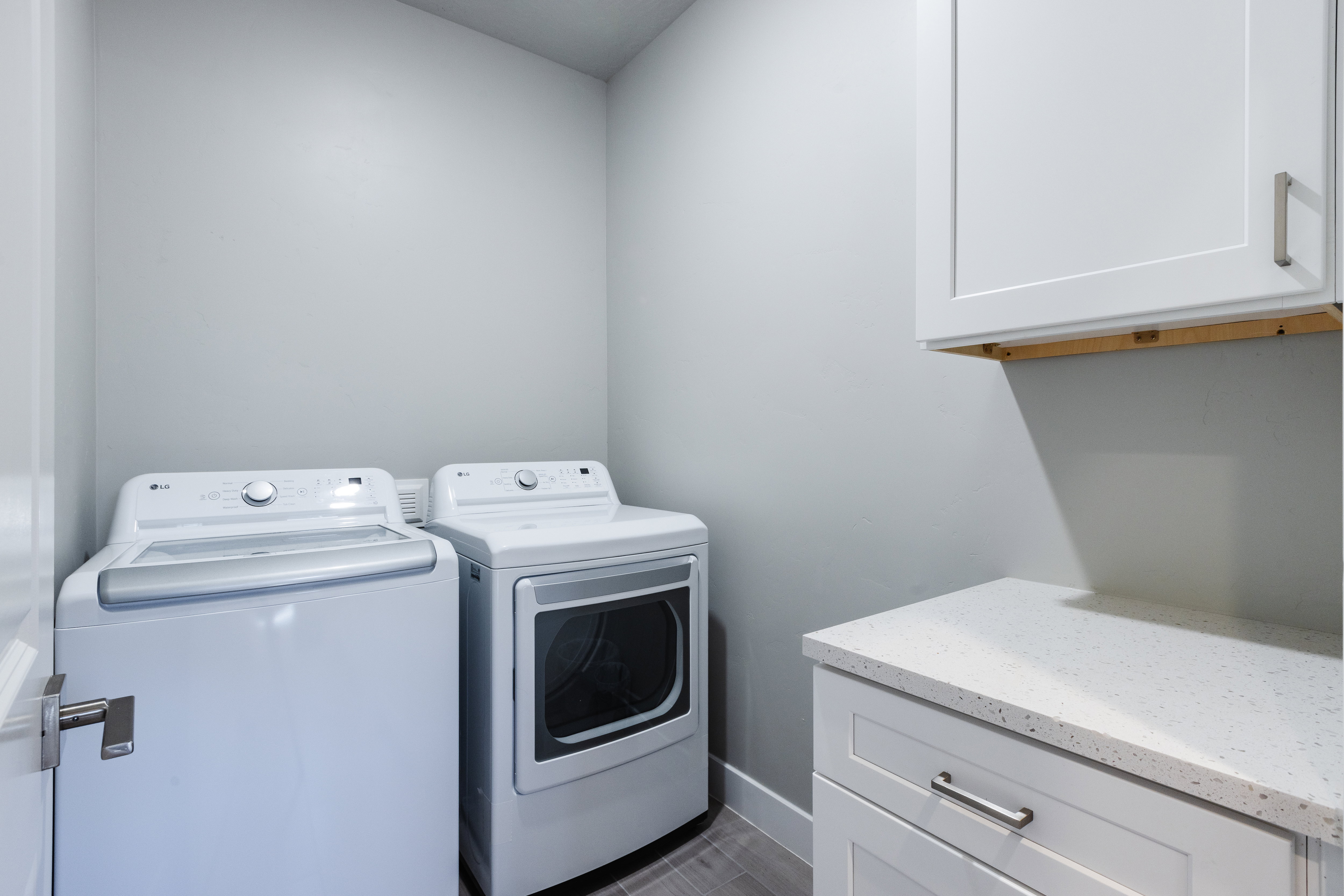 Laundry room with cabinet space and separate washer and dryer