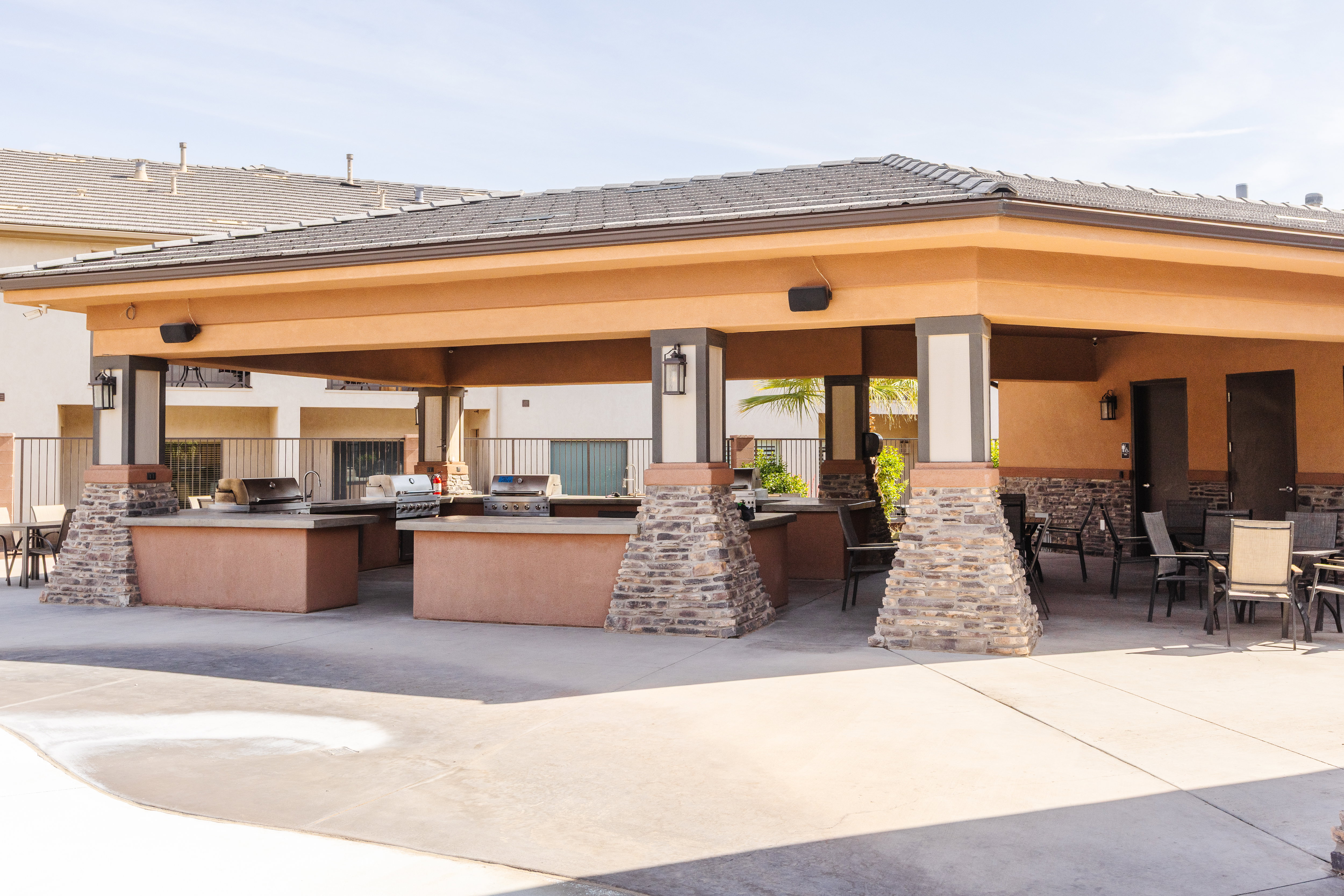 View of patio / terrace with an outdoor kitchen and an outdoor bar and dining area
