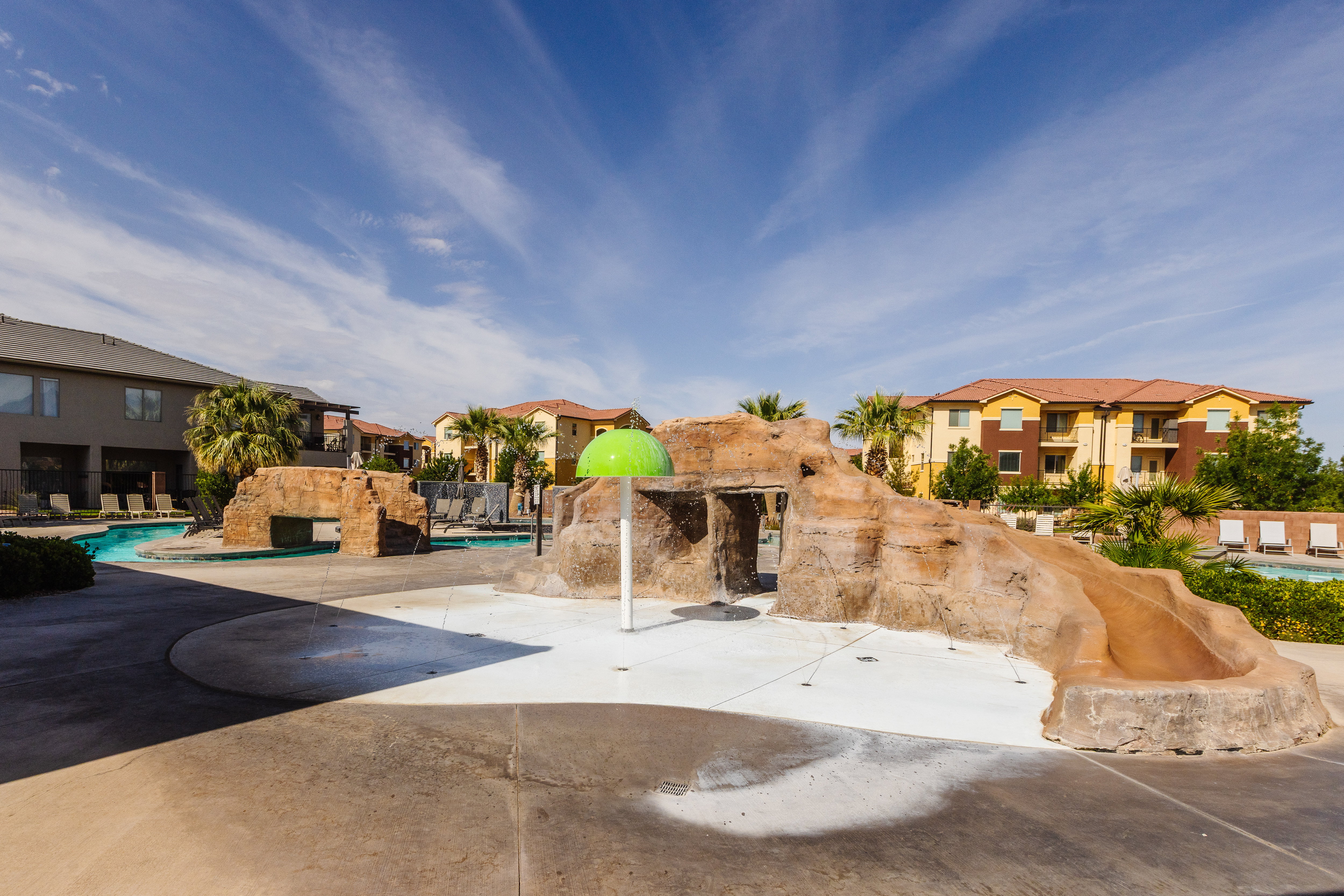 View of community with a pool, a patio, and a residential view