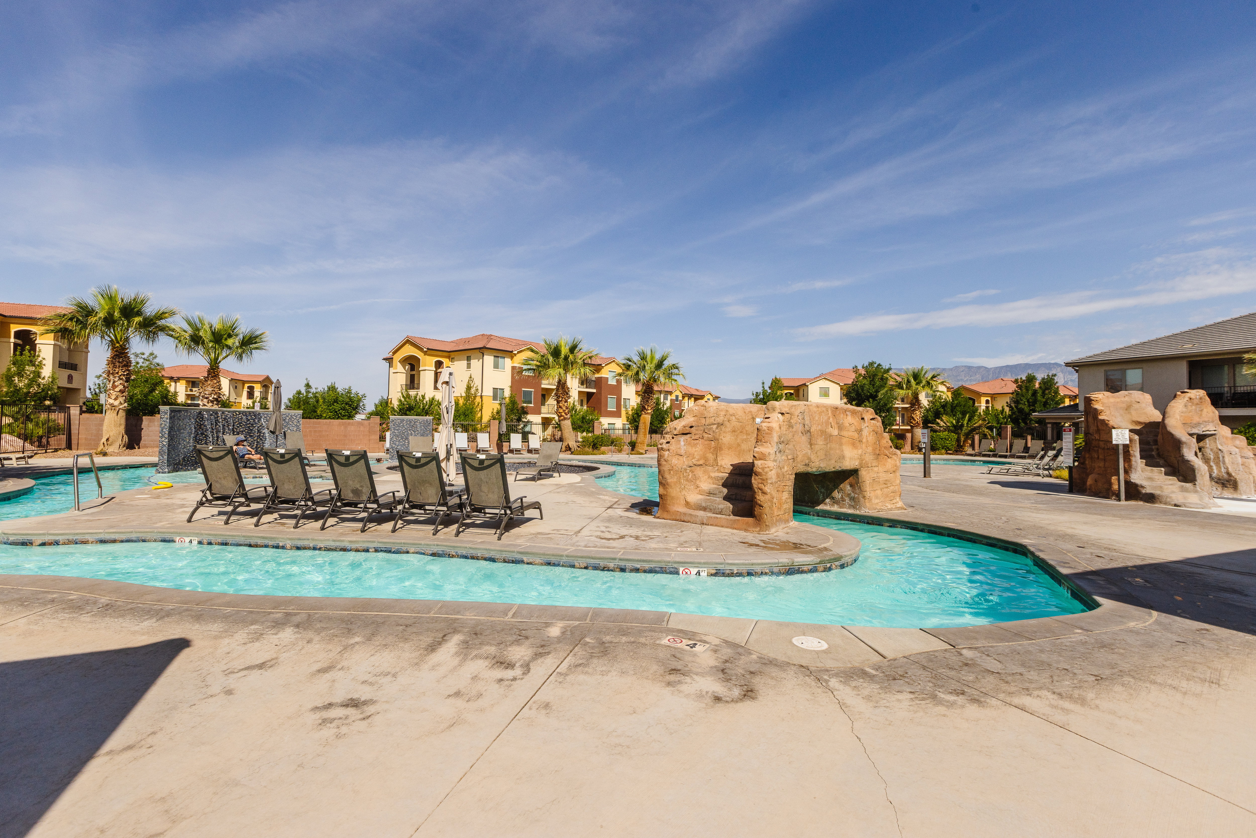 Community pool featuring a patio area and a residential view