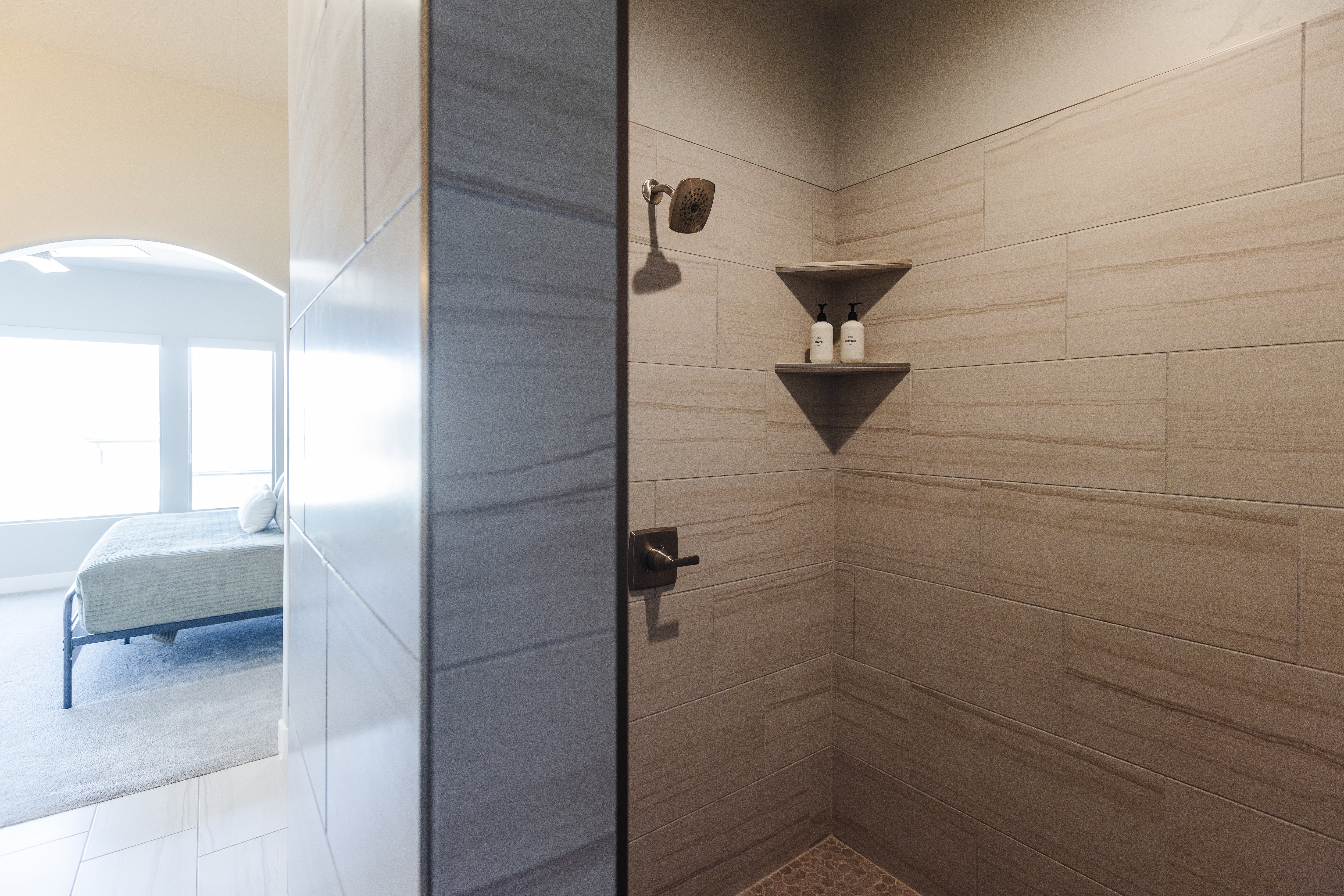Ensuite bathroom featuring a shower stall