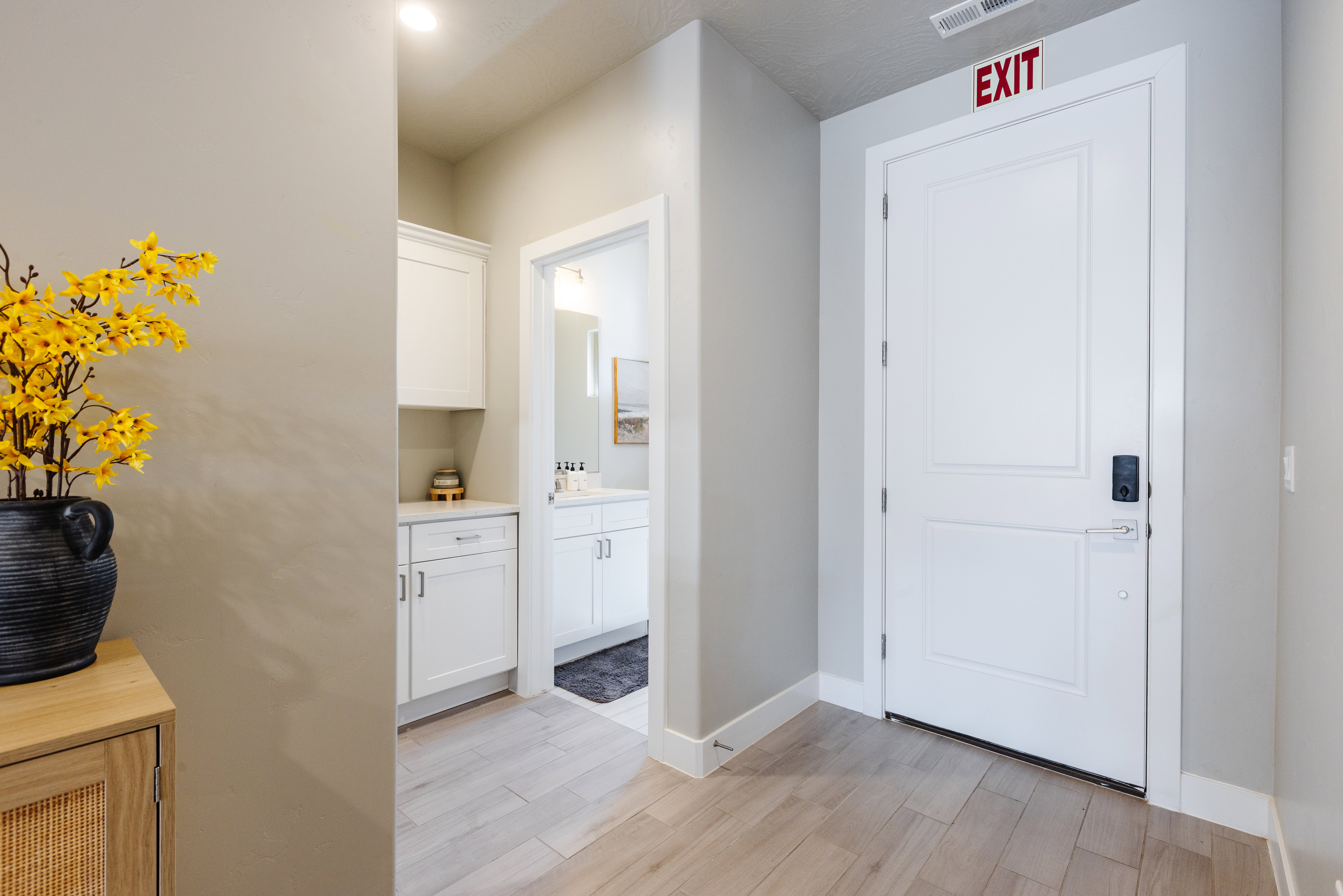 Foyer featuring light wood-style flooring and baseboards