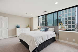 Bedroom with carpet floors and recessed lighting