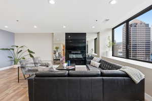 Living room featuring light wood-style flooring and recessed lighting