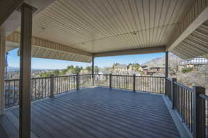 Deck featuring a residential view and a mountain view
