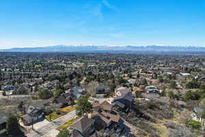 Aerial perspective of suburban area with a mountainous background