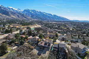 Aerial perspective of suburban area with a mountain backdrop