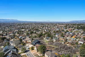 Aerial perspective of suburban area featuring a mountainous background