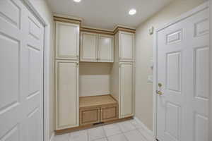 Mudroom featuring light tile patterned flooring and recessed lighting