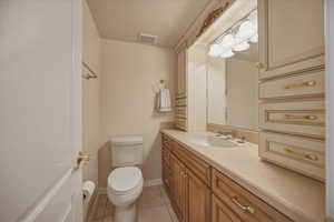 Bathroom with vanity and light tile patterned floors
