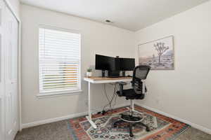 Office space featuring carpet flooring