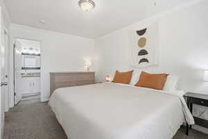 Bedroom featuring carpet flooring and ornamental molding