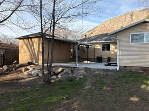 Back of property with a patio area
