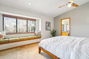 Bedroom with light carpet and ceiling fan