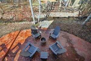 View of patio / terrace with an outdoor fire pit