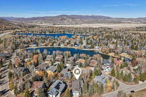 Aerial view of residential area featuring a water and mountain view